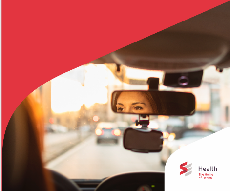 Rear-view mirror environmental still with red swoosh corner treatment , in-market SE Health campaign.